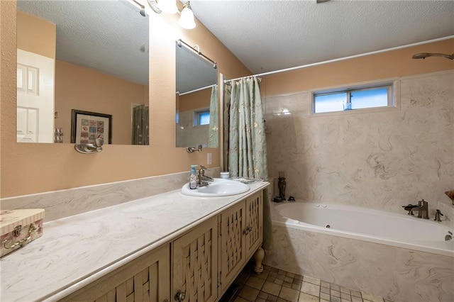 bathroom with a textured ceiling, tile patterned flooring, vanity, and shower / bath combo