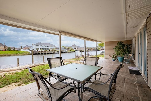 view of patio with a water view