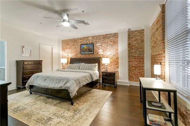 bedroom featuring brick wall, crown molding, dark hardwood / wood-style flooring, and ceiling fan