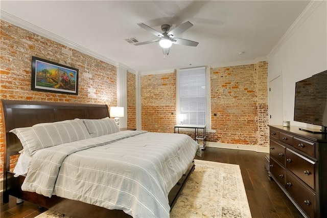 bedroom featuring dark hardwood / wood-style flooring, ceiling fan, brick wall, and crown molding