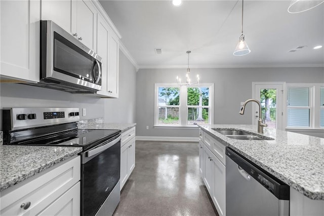 kitchen with stainless steel appliances, white cabinetry, plenty of natural light, and sink