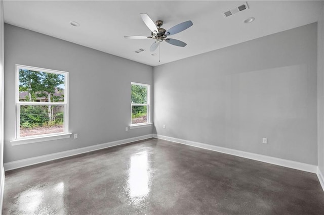 empty room with plenty of natural light and ceiling fan