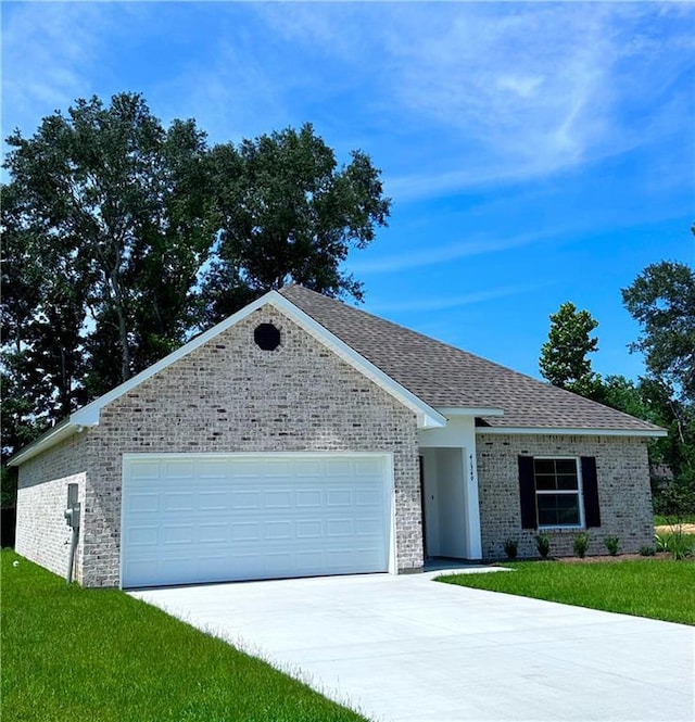 ranch-style house with a front lawn and a garage