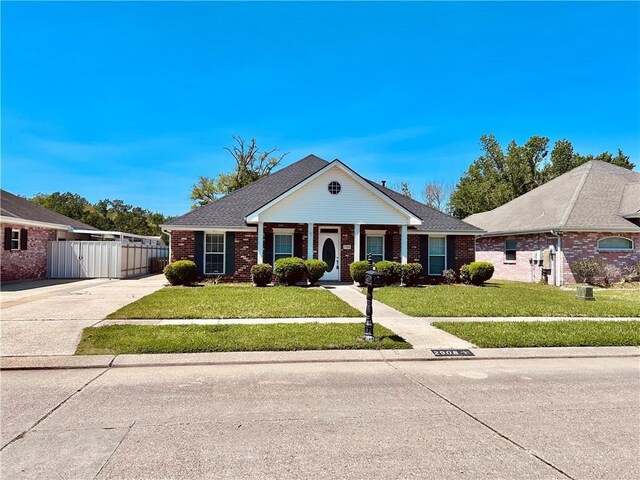 ranch-style house featuring a front lawn