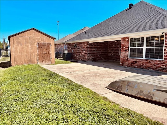 exterior space with a patio, central air condition unit, and a shed