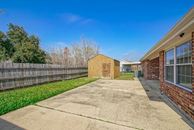 view of patio / terrace featuring central AC and a storage unit