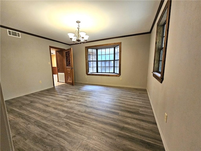 unfurnished room with an inviting chandelier, crown molding, and dark wood-type flooring