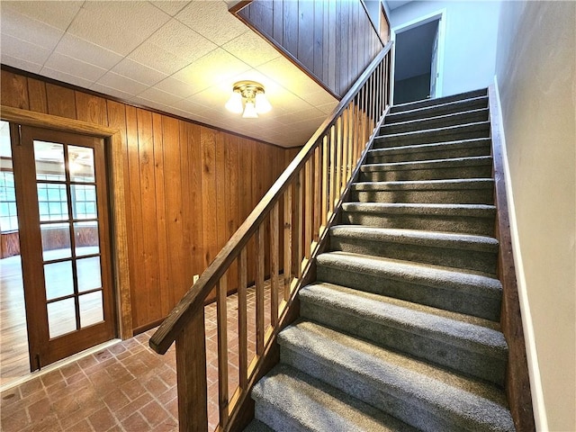 stairway with wooden walls