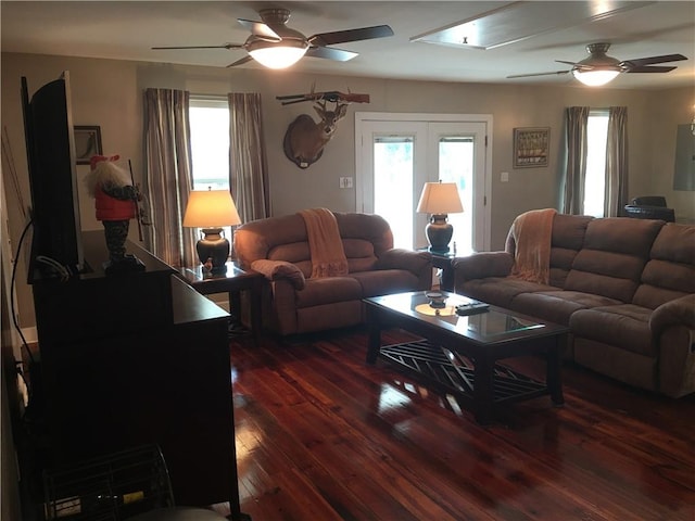 living room with ceiling fan, dark wood-type flooring, and french doors