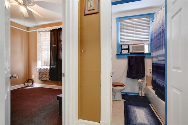 bathroom featuring ceiling fan, tile flooring, toilet, and shower / bath combo