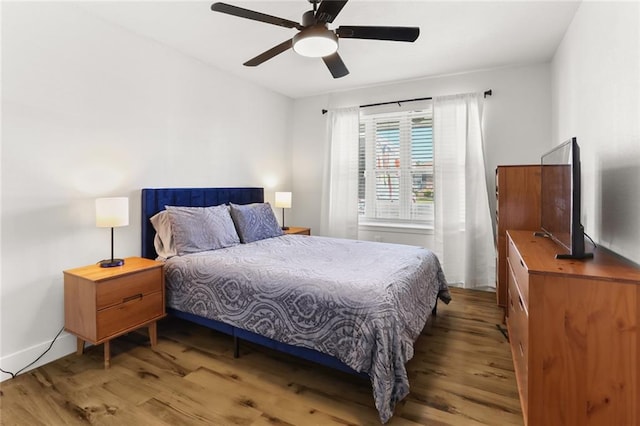 bedroom featuring ceiling fan and hardwood / wood-style flooring