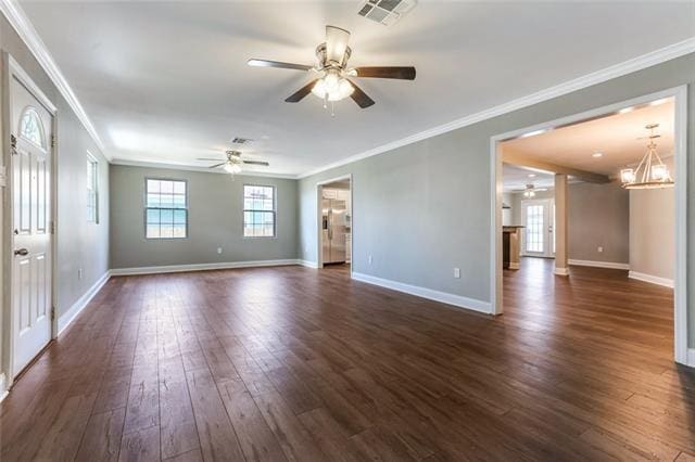 interior space with crown molding, ceiling fan with notable chandelier, and dark wood-type flooring