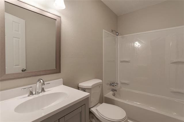 full bathroom featuring shower / washtub combination, toilet, and vanity