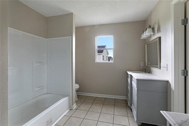 full bathroom featuring shower / washtub combination, tile flooring, toilet, a textured ceiling, and large vanity