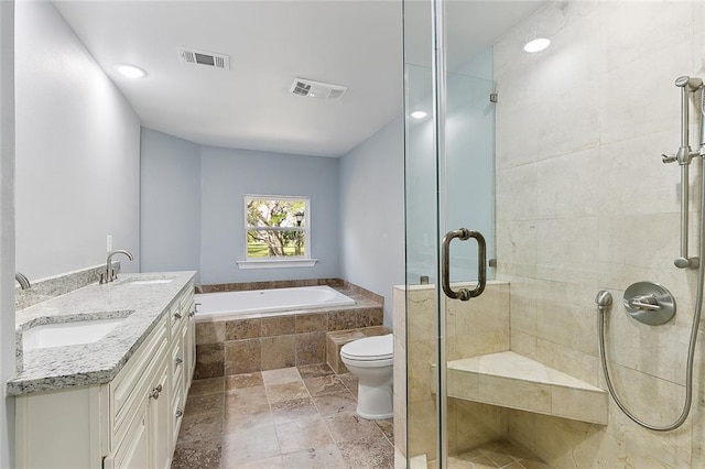 full bathroom featuring tile flooring, independent shower and bath, double vanity, and toilet