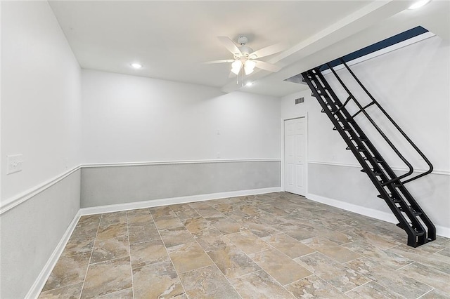 empty room with light tile floors and ceiling fan