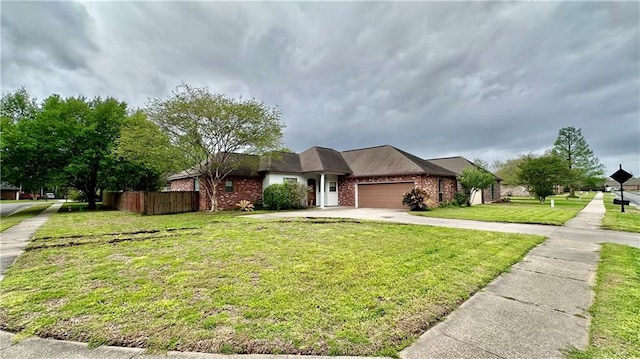 view of front of home with a front yard and a garage