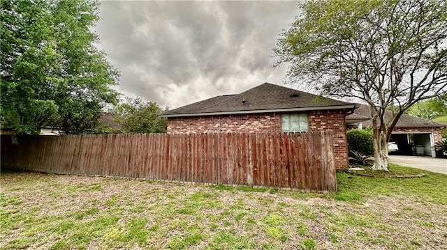 view of side of property featuring a yard