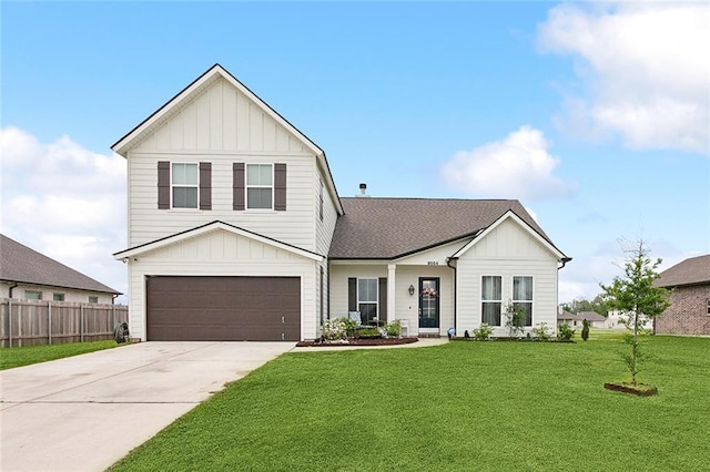 view of front of property featuring a garage and a front lawn