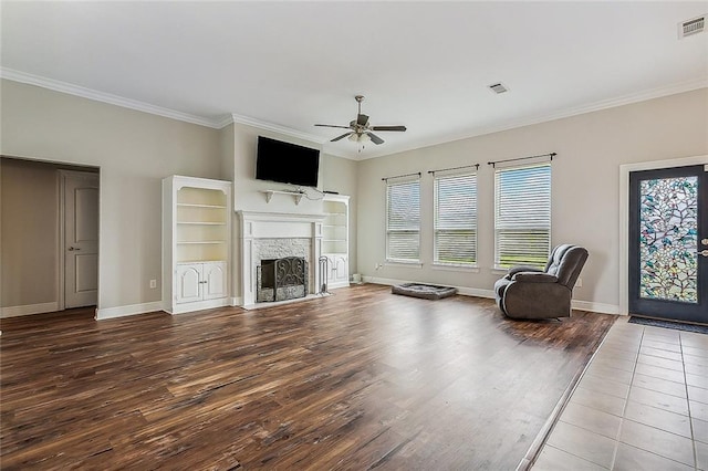 living room with ceiling fan, crown molding, and wood-type flooring