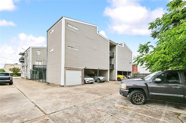 view of side of property featuring a garage