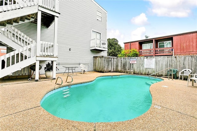 view of pool featuring a patio