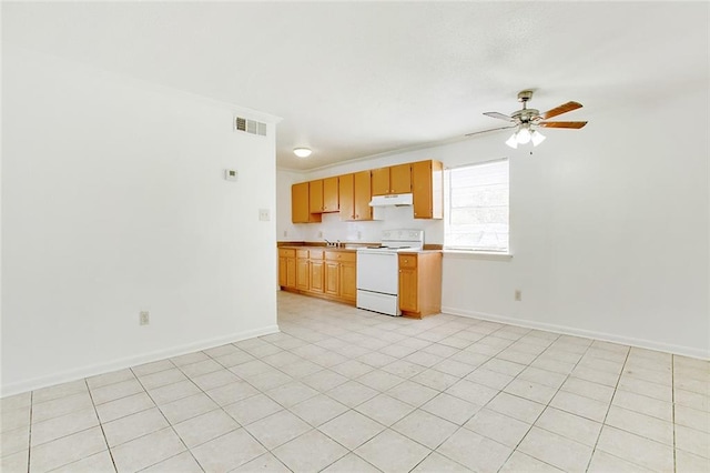 kitchen featuring sink, ceiling fan, light tile patterned flooring, and electric range