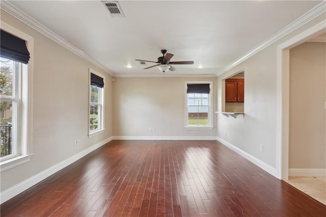 unfurnished room with dark wood-type flooring, ceiling fan, and crown molding