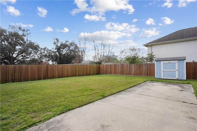 view of yard with a patio area and a storage shed