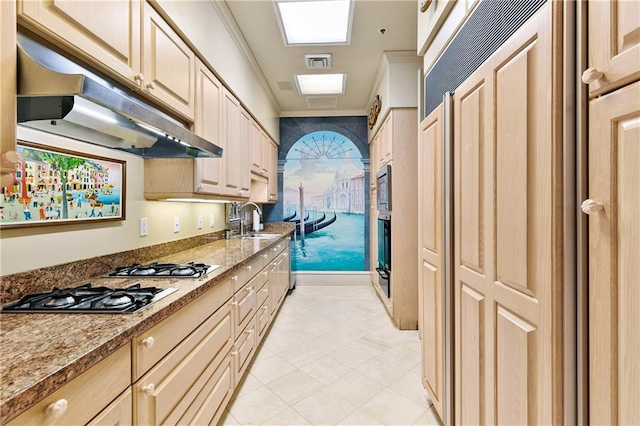 kitchen with light brown cabinets, sink, stainless steel gas cooktop, light stone countertops, and crown molding