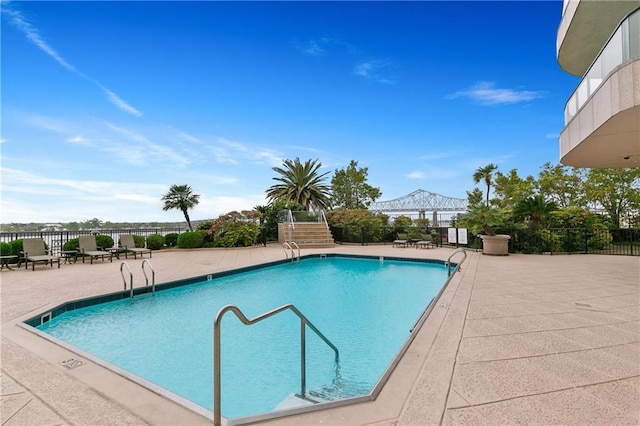 view of swimming pool with a patio