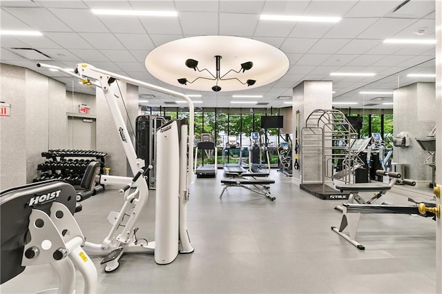 gym featuring a paneled ceiling