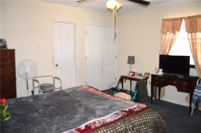 bedroom with dark carpet and ceiling fan