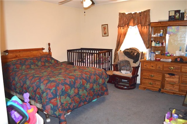 bedroom featuring dark carpet and ceiling fan