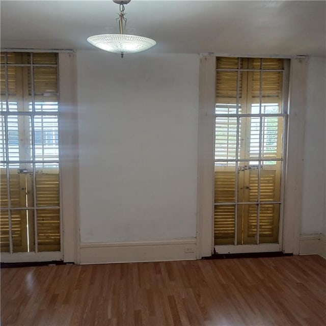 1322 Kerlerec St, New Orleans, LA 70116 - spare room with wood finished floors and baseboards
