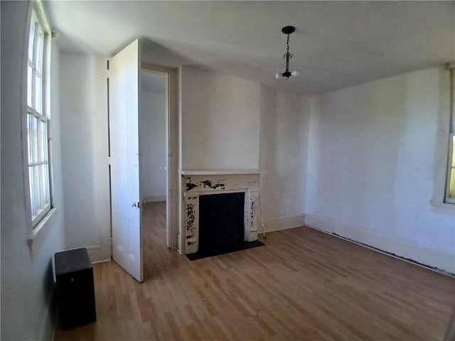 unfurnished living room featuring light hardwood / wood-style flooring