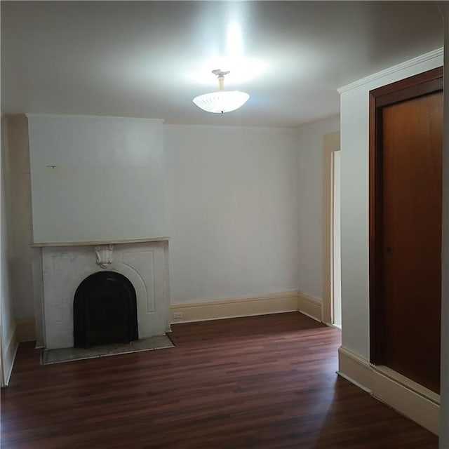 1322 Kerlerec St, New Orleans, LA 70116 - unfurnished living room with dark wood finished floors, a fireplace, and baseboards