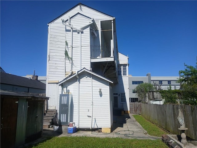 back of house with a balcony