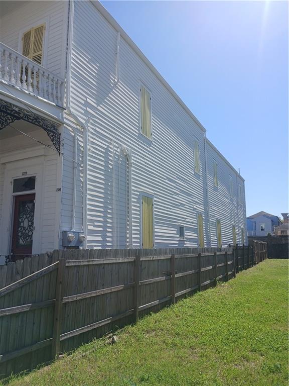 1322 Kerlerec St, New Orleans, LA 70116 - view of side of property featuring a balcony