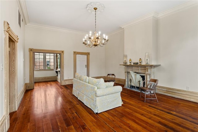 unfurnished living room with a chandelier, hardwood / wood-style floors, and ornamental molding