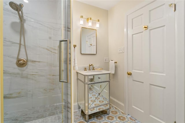 bathroom with vanity and a shower with shower door