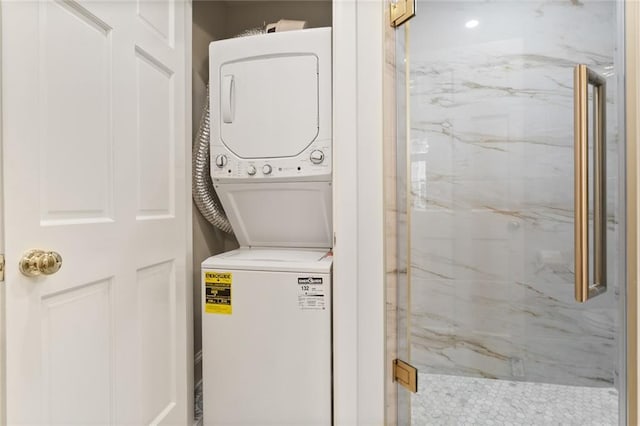 washroom with stacked washer / drying machine