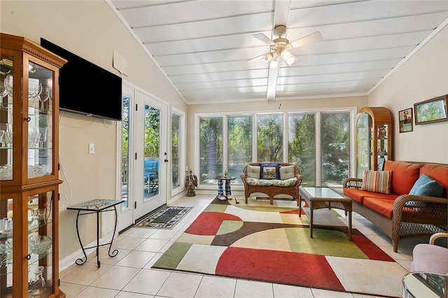 sunroom with ceiling fan and vaulted ceiling with beams