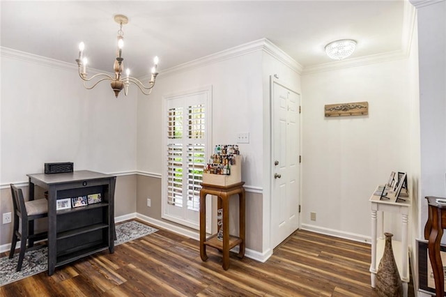 entryway featuring dark hardwood / wood-style flooring, a notable chandelier, and ornamental molding