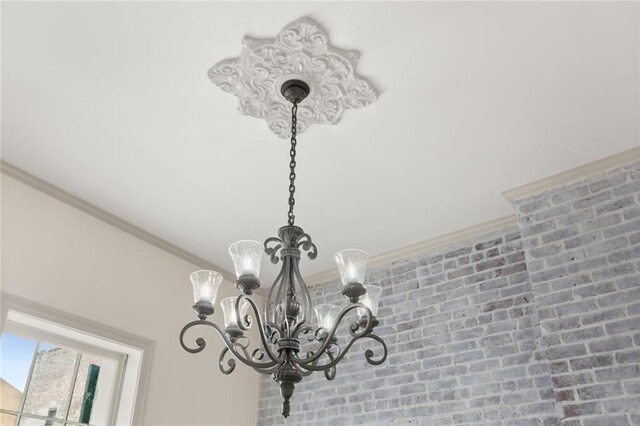 details featuring a notable chandelier and ornamental molding