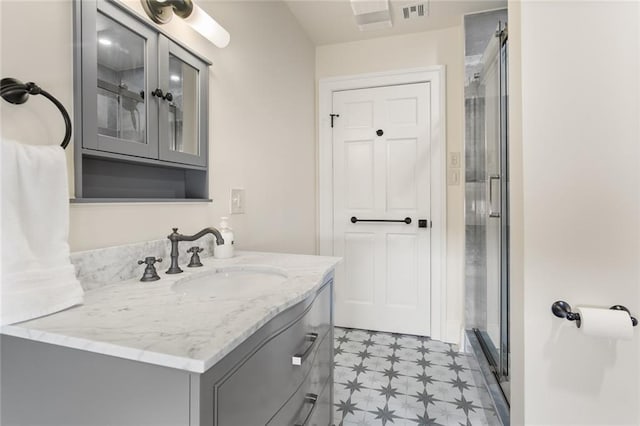 bathroom featuring vanity and walk in shower