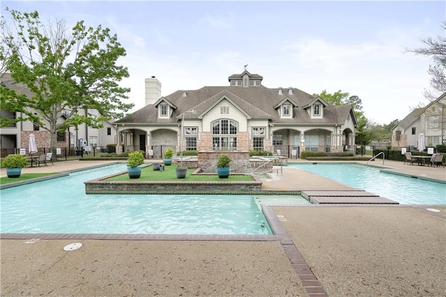 view of pool featuring a patio area