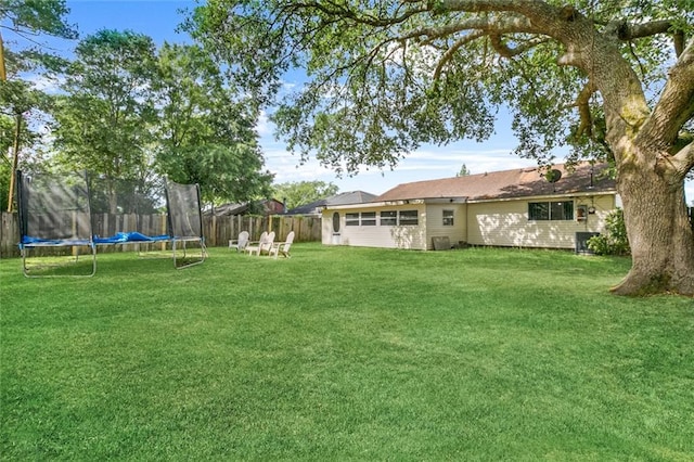 view of yard featuring a trampoline