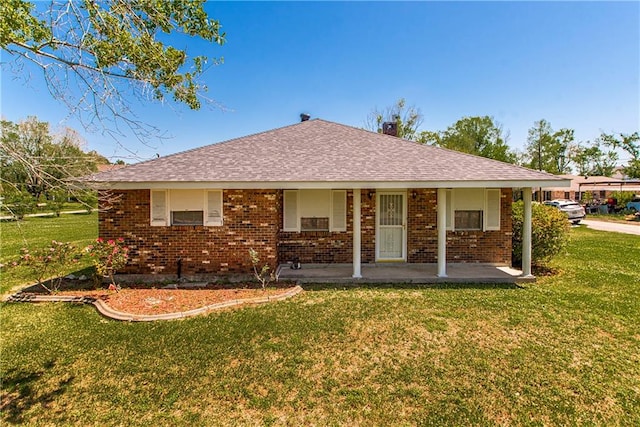 exterior space with a front yard and a porch