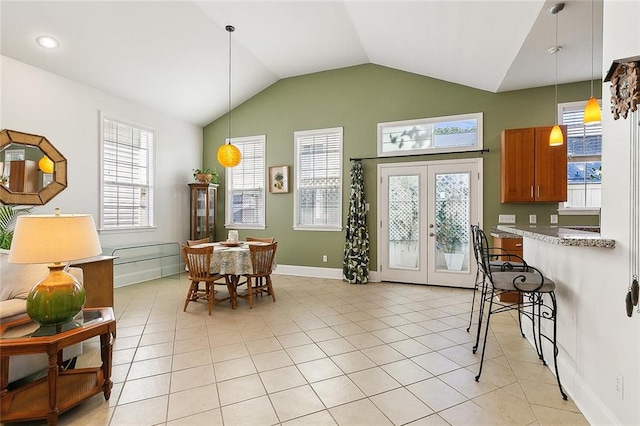 kitchen with a healthy amount of sunlight, french doors, and light tile flooring